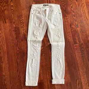 Low rise white skinny jeans ripped